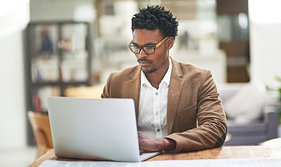Person at a desk using a laptop